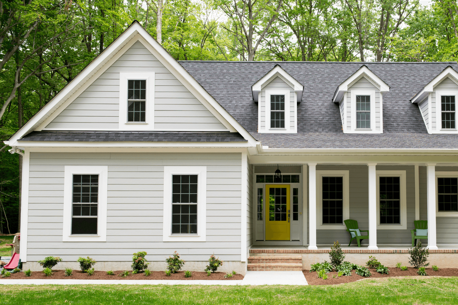 Home exterior renovation with scaffolding and active work area